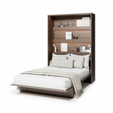 Open double vertical pull-down wall bed in Oak Dunin finish with mattress on display.